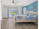 Primary bedroom featuring a slider to the pool area and coastal decor at 269 Mark Twain Ln, Rotonda West, FL 33947
