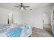 Spacious bedroom with natural light, ceiling fan, and en-suite bathroom at 269 Mark Twain Ln, Rotonda West, FL 33947