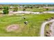 An aerial view capturing golf carts on a well-maintained course, highlighting its serene and spacious layout at 269 Mark Twain Ln, Rotonda West, FL 33947