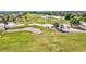 A vibrant golf course featuring a sand trap with trimmed fairways and trees at 269 Mark Twain Ln, Rotonda West, FL 33947