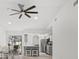 Open concept kitchen and dining room with island and access to lanai at 269 Mark Twain Ln, Rotonda West, FL 33947