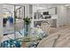 Kitchen dining featuring stainless appliances, gray cabinets and access to lanai at 269 Mark Twain Ln, Rotonda West, FL 33947