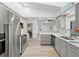 Well-equipped kitchen with stainless steel appliances, white countertops, and open layout at 269 Mark Twain Ln, Rotonda West, FL 33947