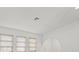Bright room featuring three windows and sleek, modern wood laminate flooring at 269 Mark Twain Ln, Rotonda West, FL 33947
