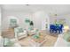 Living room features wicker furniture, coastal decor, and open floor plan at 269 Mark Twain Ln, Rotonda West, FL 33947