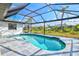 Enclosed pool with a screened enclosure, offering a private and relaxing outdoor space at 269 Mark Twain Ln, Rotonda West, FL 33947