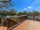 Backyard deck overlooking lush green grass and refreshing pool with clear blue skies at 27215 Crosby Rd, Myakka City, FL 34251
