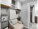 Laundry Room with storage, chair, and artwork at 27215 Crosby Rd, Myakka City, FL 34251