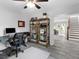 Office featuring a desk, bookshelf, and comfortable chair at 27215 Crosby Rd, Myakka City, FL 34251