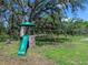 Outdoor playground with climbing structure, slide, and swings, perfect for Gathering fun at 27215 Crosby Rd, Myakka City, FL 34251