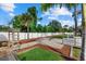 Expansive fenced backyard featuring a paved patio area with a charming fire pit at 2769 Dode Ave, North Port, FL 34288