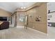Open dining room with neutral colors, hard surface floors and view to adjacent kitchen and living spaces at 2769 Dode Ave, North Port, FL 34288