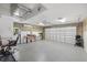 Spacious garage with a finished floor, overhead storage, and a work area at 2769 Dode Ave, North Port, FL 34288