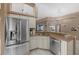 Kitchen view with granite countertops, stainless steel appliances, and access to the dining room at 2769 Dode Ave, North Port, FL 34288