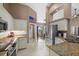 Spacious kitchen with white cabinets, granite countertops, stainless appliances and ample lighting at 2769 Dode Ave, North Port, FL 34288