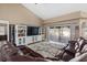 Spacious living room features a large entertainment center and sliding glass doors to the outside at 2769 Dode Ave, North Port, FL 34288