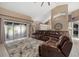 Spacious living room featuring a large sectional sofa, sliding glass doors, and neutral-toned walls at 2769 Dode Ave, North Port, FL 34288