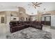 Open living area with tile flooring, a comfortable sectional sofa, and ample natural light at 2769 Dode Ave, North Port, FL 34288