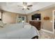 Spacious main bedroom featuring wood floors, a tray ceiling, and large dresser at 2769 Dode Ave, North Port, FL 34288