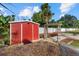 Backyard shed and arbor surrounded by gravel and stone path at 2769 Dode Ave, North Port, FL 34288