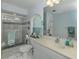 Bathroom with glass enclosed shower and ample lighting at 304 Rosewood Ct, Venice, FL 34293