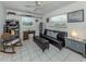 Spare bedroom with futon, desk and white tiled floor at 304 Rosewood Ct, Venice, FL 34293