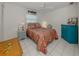 Comfortable bedroom features white tile floors and unique coastal decor at 304 Rosewood Ct, Venice, FL 34293