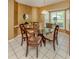 Cozy dining room with tile floors and large windows allowing natural light at 304 Rosewood Ct, Venice, FL 34293