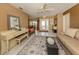 Bright living room with a view into the dining room and featuring tile flooring at 304 Rosewood Ct, Venice, FL 34293