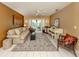 Cozy living room with neutral tones, French doors, and tile flooring at 304 Rosewood Ct, Venice, FL 34293