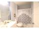 Bathroom featuring a single sink vanity, toilet and shower with a decorative curtain at 320 Clearbrook Cir # 203, Venice, FL 34292