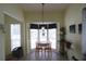 Charming dining area featuring a bay window, pendant lighting, and seating for two at 320 Clearbrook Cir # 203, Venice, FL 34292