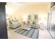 Bright living room featuring comfortable sofas, stylish decor, and a serene ambiance at 320 Clearbrook Cir # 203, Venice, FL 34292
