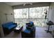 Outdoor patio with comfortable seating, perfect for relaxation and enjoying the surrounding scenery at 320 Clearbrook Cir # 203, Venice, FL 34292
