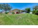 Well-maintained backyard with lush green grass and a cozy screened-in porch for outdoor relaxation at 331 Bucknell Rd, Venice, FL 34293