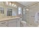 Bright bathroom with white tile shower, vanity, and toilet at 331 Bucknell Rd, Venice, FL 34293