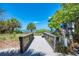 Beach access with boardwalk leading to ocean views, complete with lifeguard station and informational signage at 331 Bucknell Rd, Venice, FL 34293