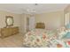 Bedroom with ceiling fan, wood floors and two wicker dressers at 331 Bucknell Rd, Venice, FL 34293