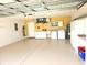 Spacious garage featuring washer, dryer, sink, cabinets, and epoxy flooring at 331 Bucknell Rd, Venice, FL 34293