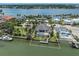 Gorgeous aerial view showcasing the property's waterfront location, private dock, and luxurious pool at 333 Sunrise Dr, Nokomis, FL 34275