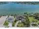 Expansive aerial view of the property featuring waterfront, a private dock, and beautiful landscaping at 333 Sunrise Dr, Nokomis, FL 34275
