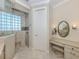 Bathroom featuring a make up vanity with an oval mirror, granite countertop, and a walk-in shower at 333 Sunrise Dr, Nokomis, FL 34275