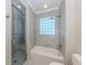 Modern bathroom with glass enclosed shower and separate bathtub at 333 Sunrise Dr, Nokomis, FL 34275