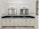 Bright bathroom with a double vanity, granite countertop, and modern fixtures and fittings at 333 Sunrise Dr, Nokomis, FL 34275