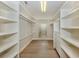 Walk-in closet with custom shelving and drawers, offering ample storage space at 333 Sunrise Dr, Nokomis, FL 34275
