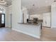 Spacious kitchen with modern appliances, granite countertops, dark island, and stainless steel sink at 333 Sunrise Dr, Nokomis, FL 34275