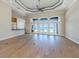 Large living room with hardwood floors and access to outdoor scenery at 333 Sunrise Dr, Nokomis, FL 34275