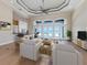 Bright and airy living room with water views and access to the patio at 333 Sunrise Dr, Nokomis, FL 34275