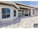 Luxury home featuring a spacious covered patio and deck with stone flooring at 333 Sunrise Dr, Nokomis, FL 34275