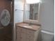 Bathroom with a vanity, mirror, toilet, and shower with etched-glass doors at 334 Dante Dr # 334, Nokomis, FL 34275